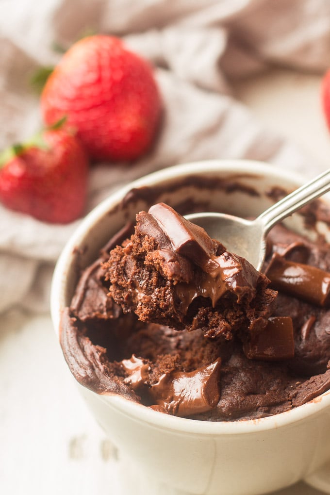 Close Up of a Spoon Scooping Vegan Chocolate Mug Cake from a Cup