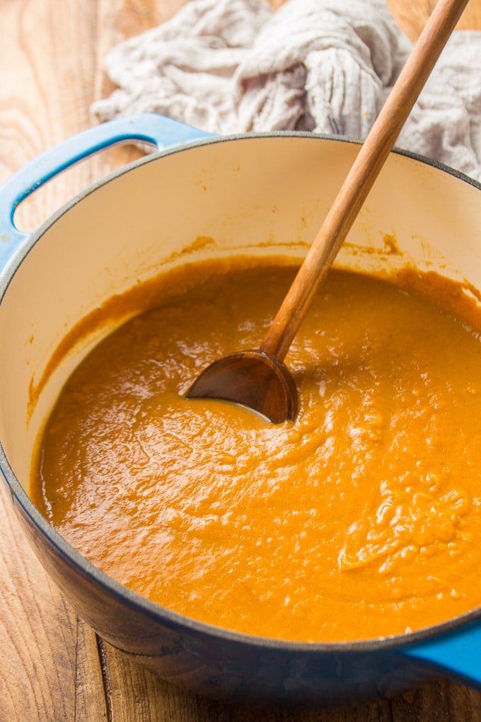 Pot of Vegan Pumpkin Soup with Wooden Spoon