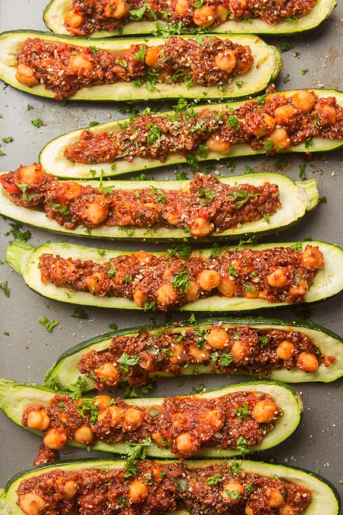 Vegan Stuffed Zucchini Boats Topped with Vegan Parmesan Cheese and Parsley