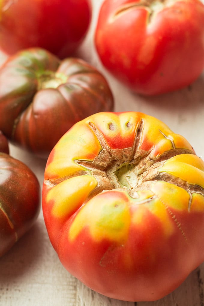 Colorful Tomatoes on a White Wooden Surface