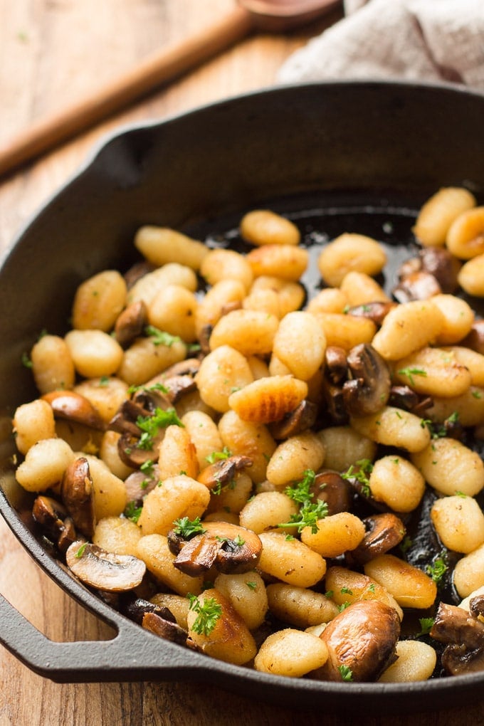 Close Up of Fried Gnocchi and Mushrooms in a Skillet