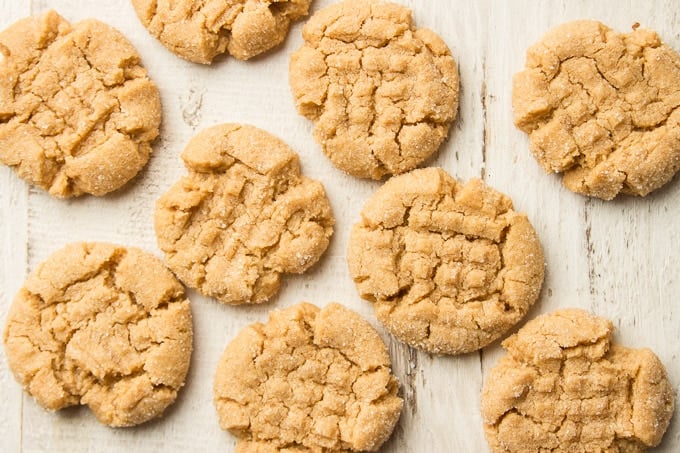 Vegan Peanut Butter Cookies Arranged on a White Wooden Surface