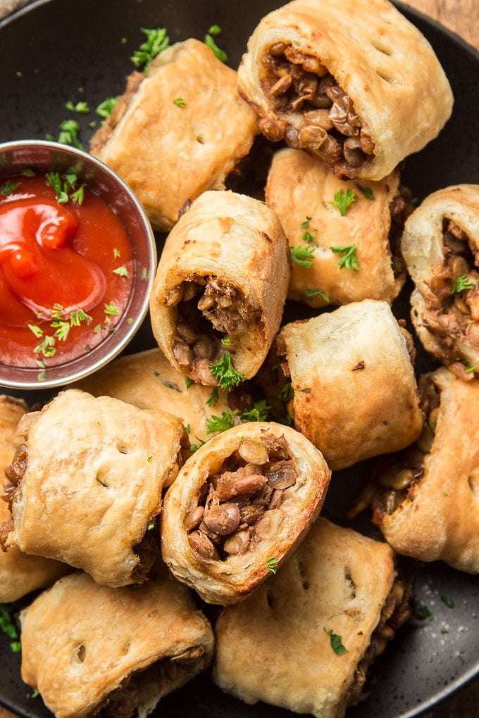Close Up of Vegan Sausage Rolls and Bowl of Ketchup Topped with Parsley