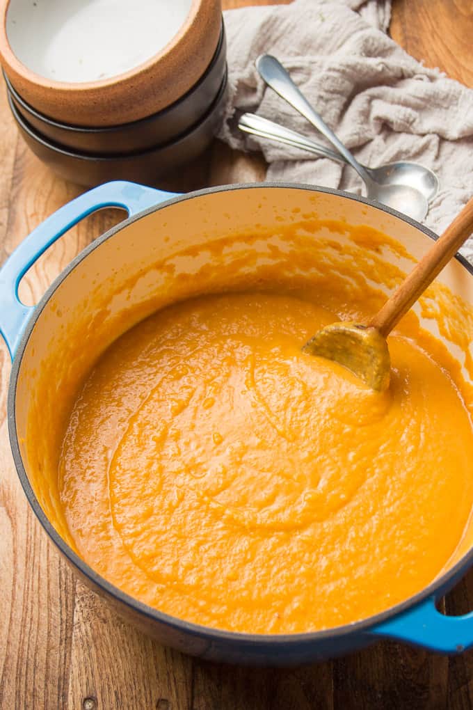 Pot of Sweet Potato Soup with Wooden Spoon