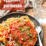 Plate of Vegan Eggplant Parmesan and Spaghetti with Text Overlay Reading "Vegan Eggplant Parmesan"