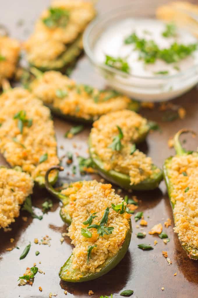 Vegan Jalapeño Poppers with a Bowl of Dipping Sauce in the Background