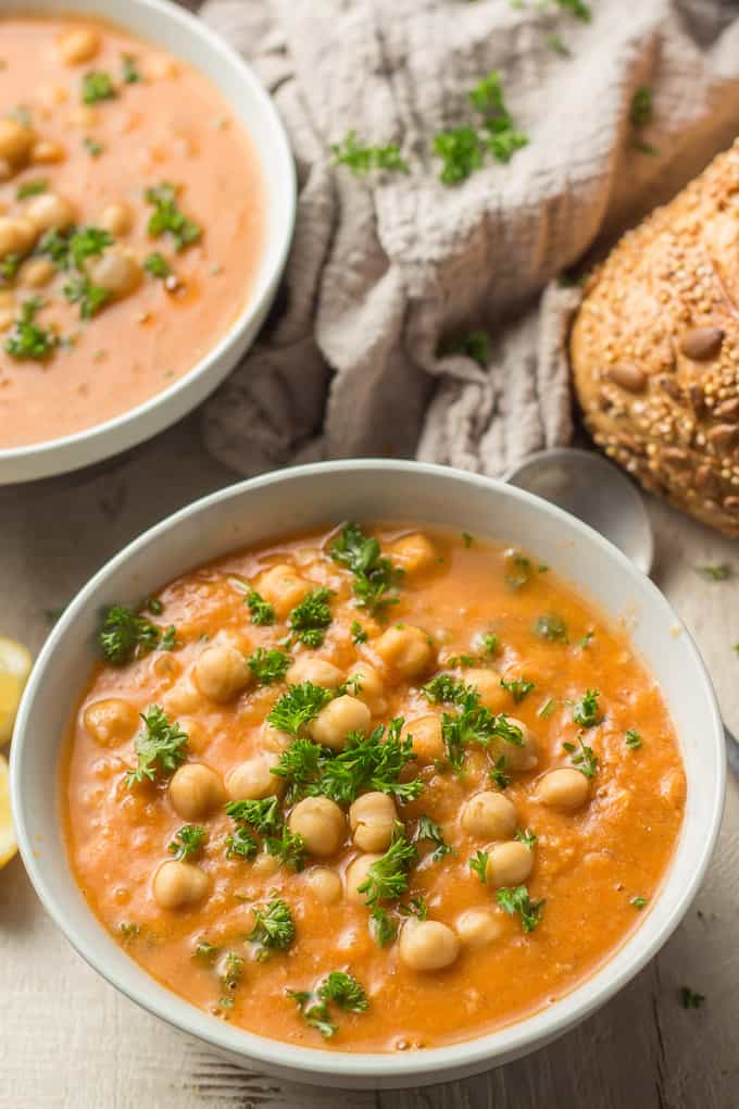 Two Bowls of Chickpea Soup, Spoon and Loaf of Bread in the Background