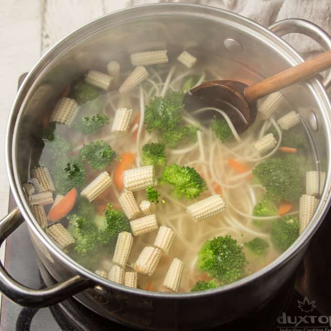 Udon Noodles and Vegetables Simmering in a Pot
