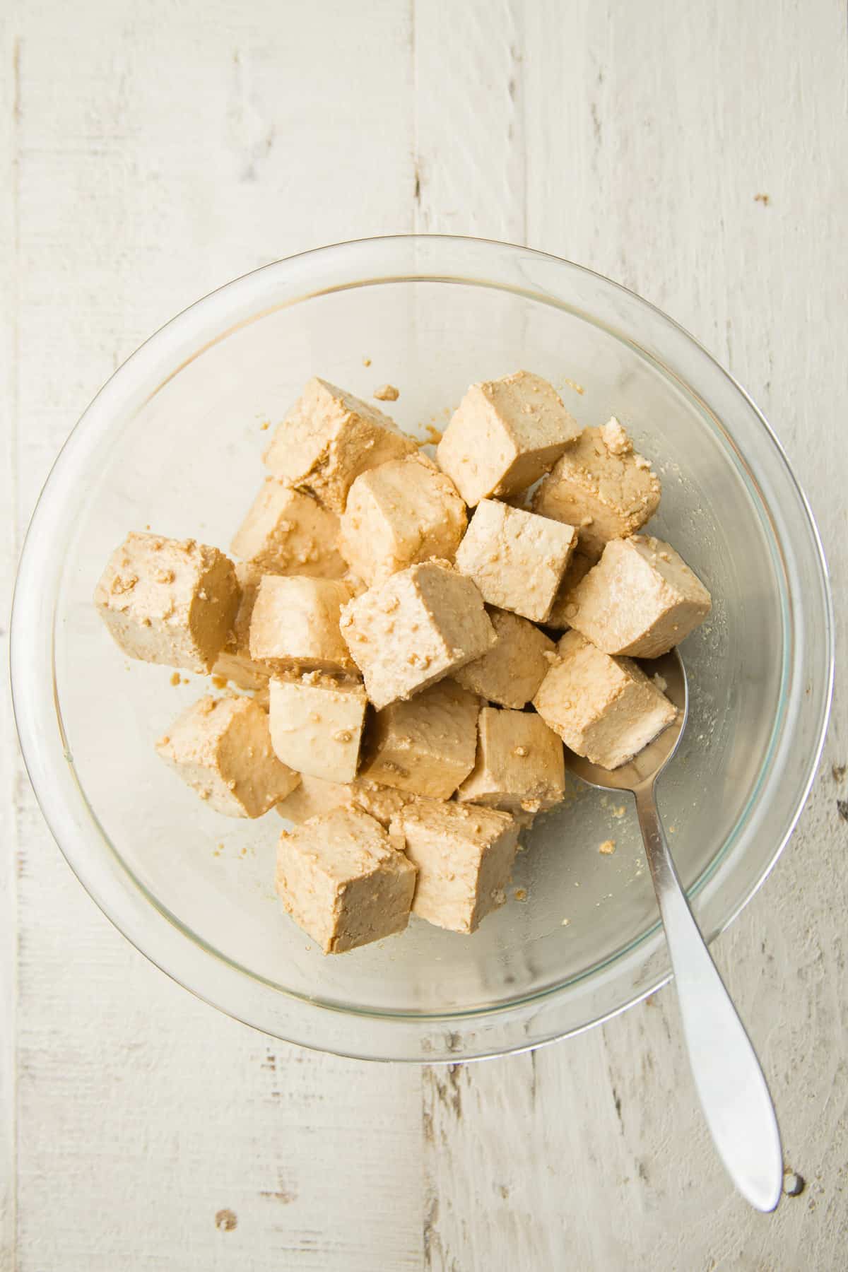 Tofu in a Bowl with Seasonings and a Spoon
