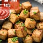 Plate of Air Fryer Tofu with Text Overlay Reading "Crispy Air Fryer Tofu"