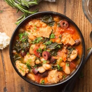Bowl of Ribollita on a Wooden Surface
