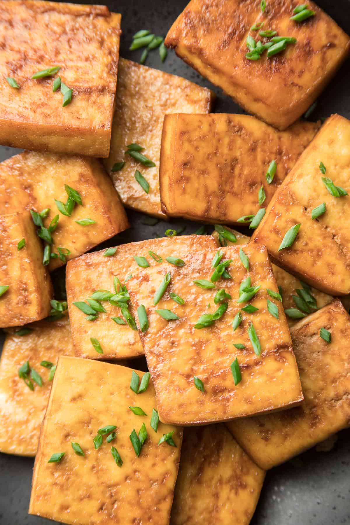 Close Up of Smoked Tofu Slices Topped with Chives