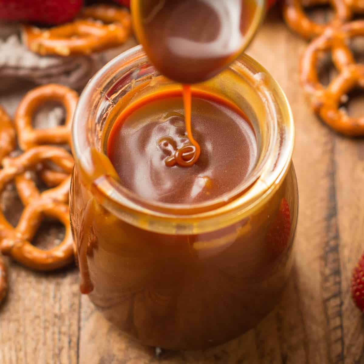 Close Up of Spoon Drizzling Vegan Caramel Sauce