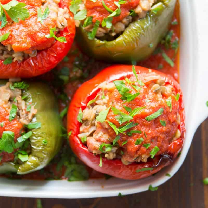 Four Vegan Stuffed Peppers in a Baking Dish