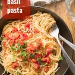 Plate of Tomato Basil Pasta with Text Overlay Reading "Tomato Basil Pasta"