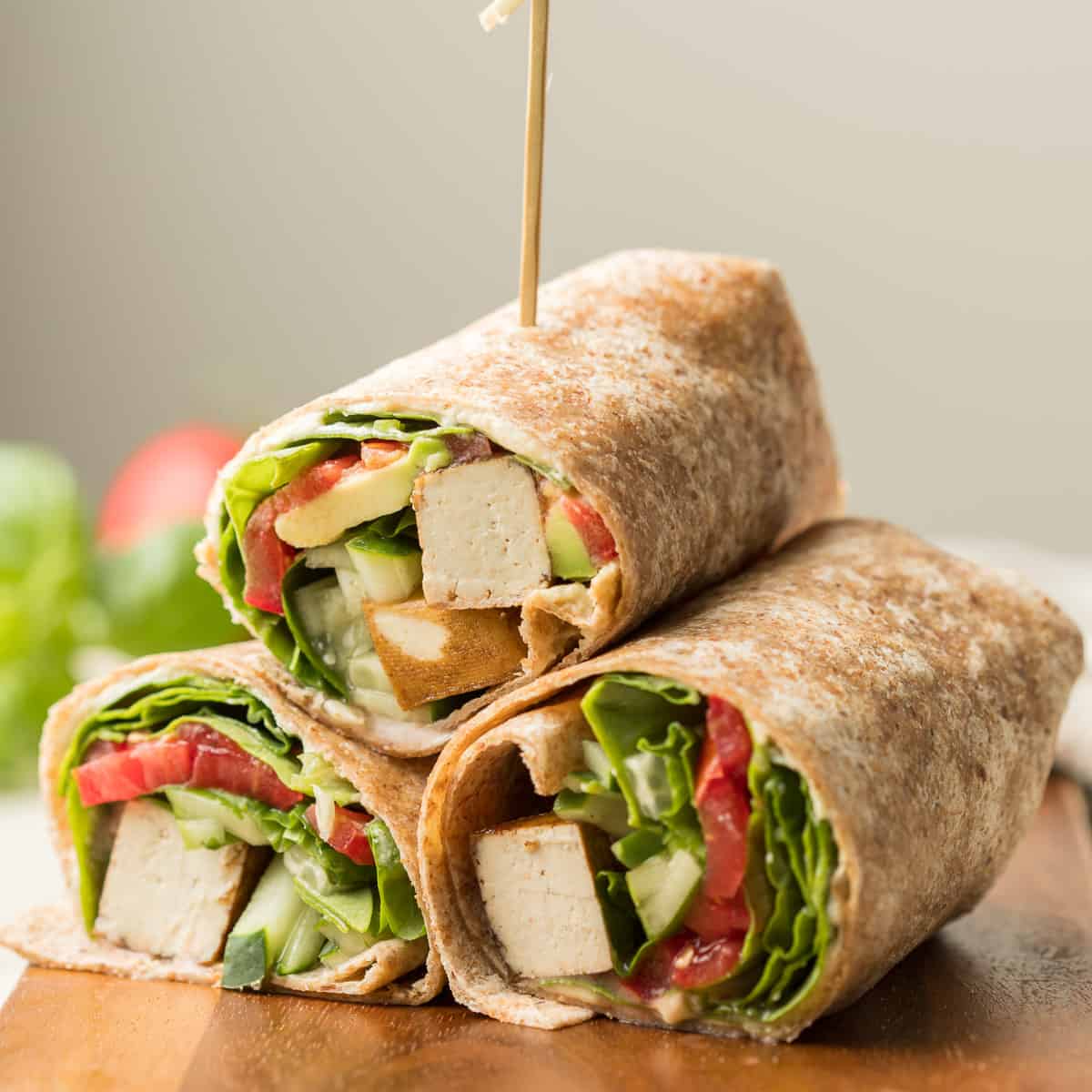 Three Vegan Wrap Halves Stacked in a Triangle