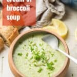 Bowl of Soup with Text Overlay Reading "Vegan Cream of Broccoli Soup"