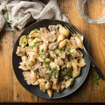Plate of Vegan Stroganoff on a Wooden Surface
