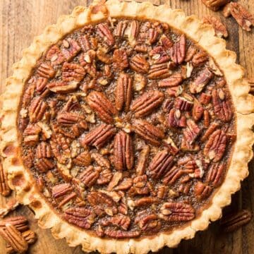 Whole Vegan Pecan Pie on a Wooden Surface