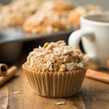 Close up of a Vegan Pumpkin Muffin with streusel on top.
