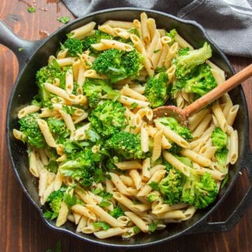Skillet of Broccoli Pasta with a Wooden Spoon