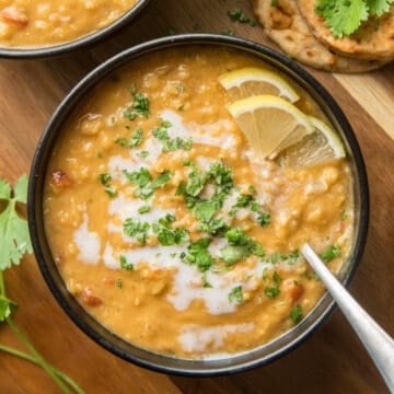 Bowl of Dal Soup Topped with Coconut Milk and Cilantro