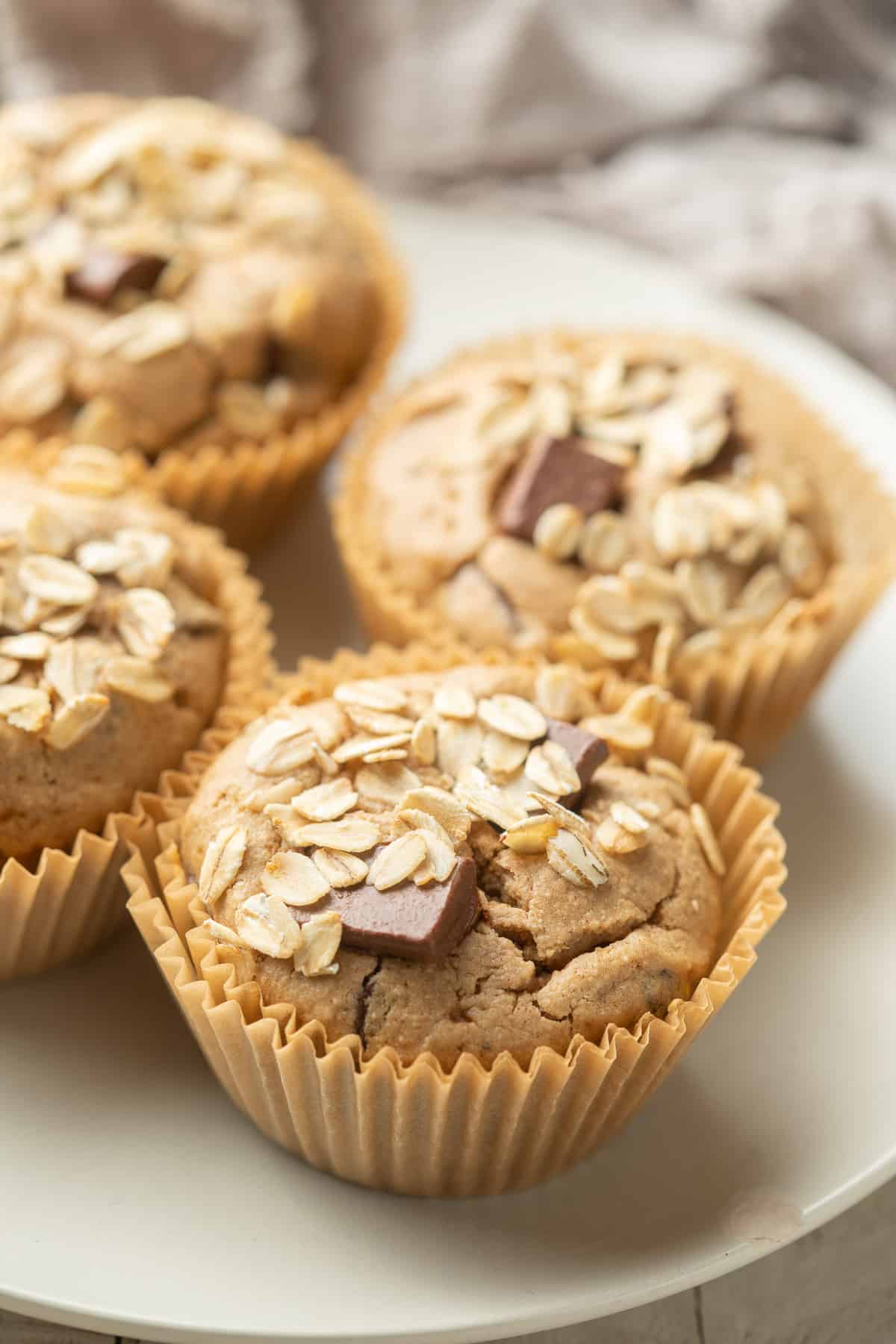 Chocolate Chip Oat Flour Muffins on a white dish.