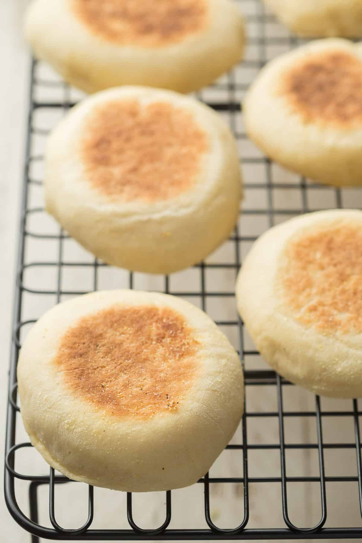 Vegan English Muffins on a cooling rack.