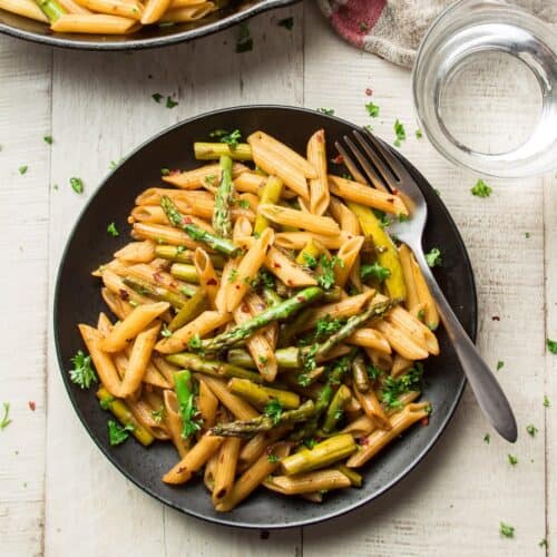 Plate of balsamic Asparagus Pasta with a fork.