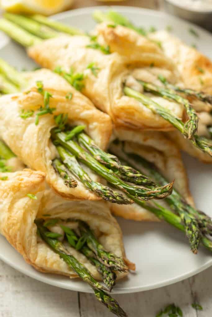 Close up of Puff Pastry Wrapped Asparagus on a plate.