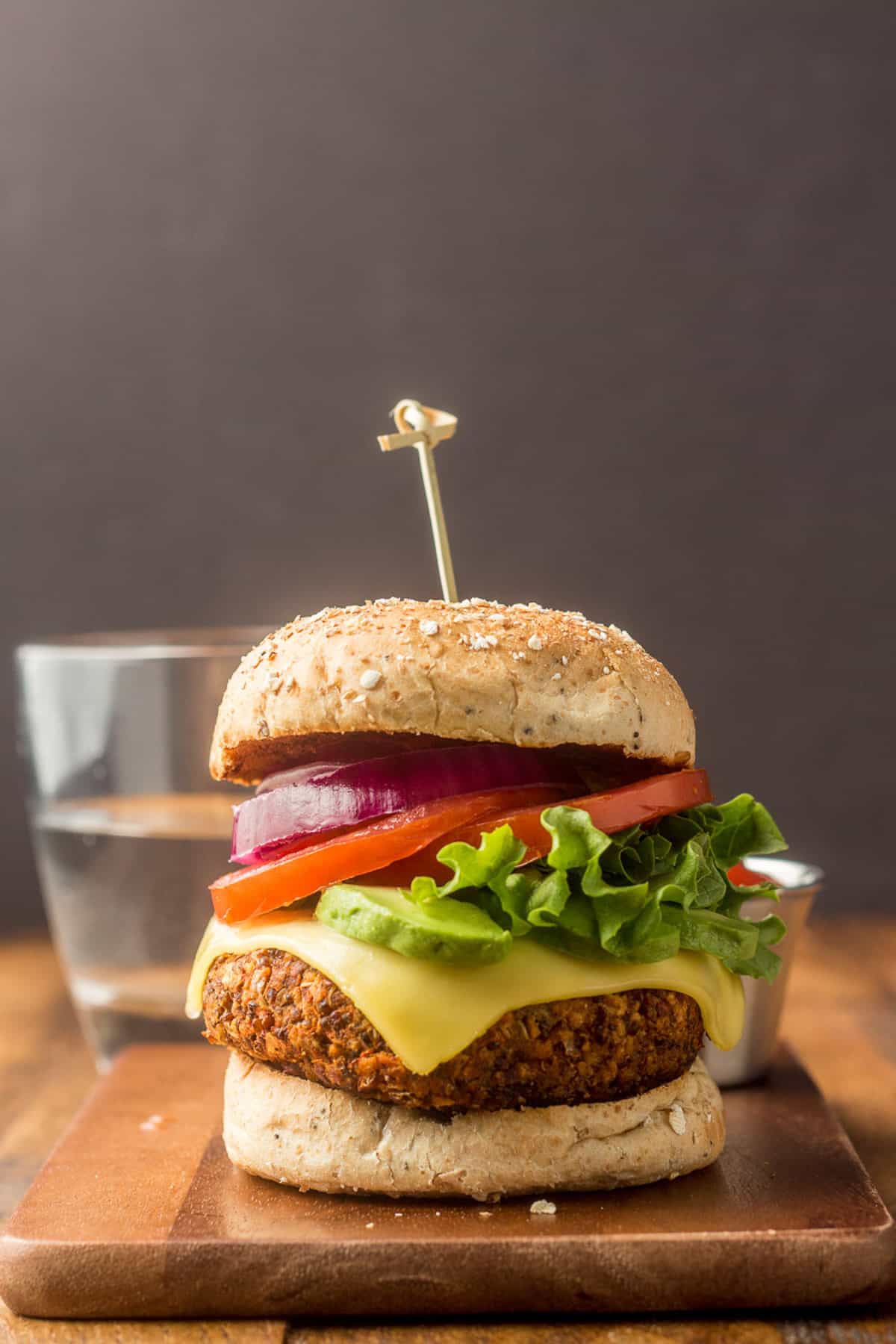 Quinoa burger with a skewer through it.