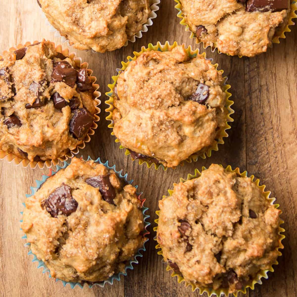 Vegan Banana Muffins on a wooden surface.