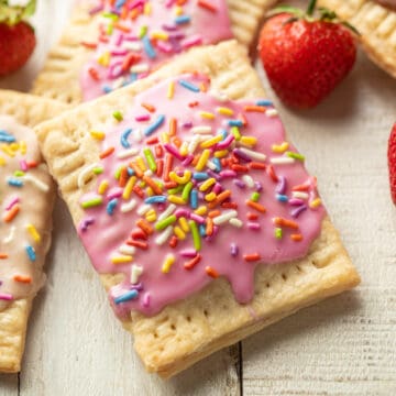 Vegan Pop Tart with pink frosting and rainbow sprinkles on top.