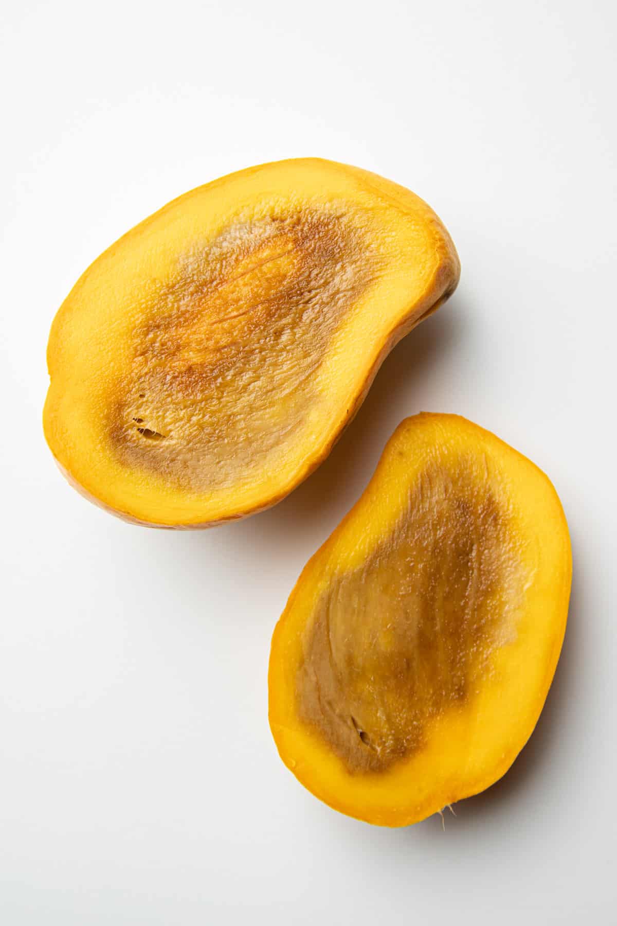 Mango sliced open with browning on the inside.
