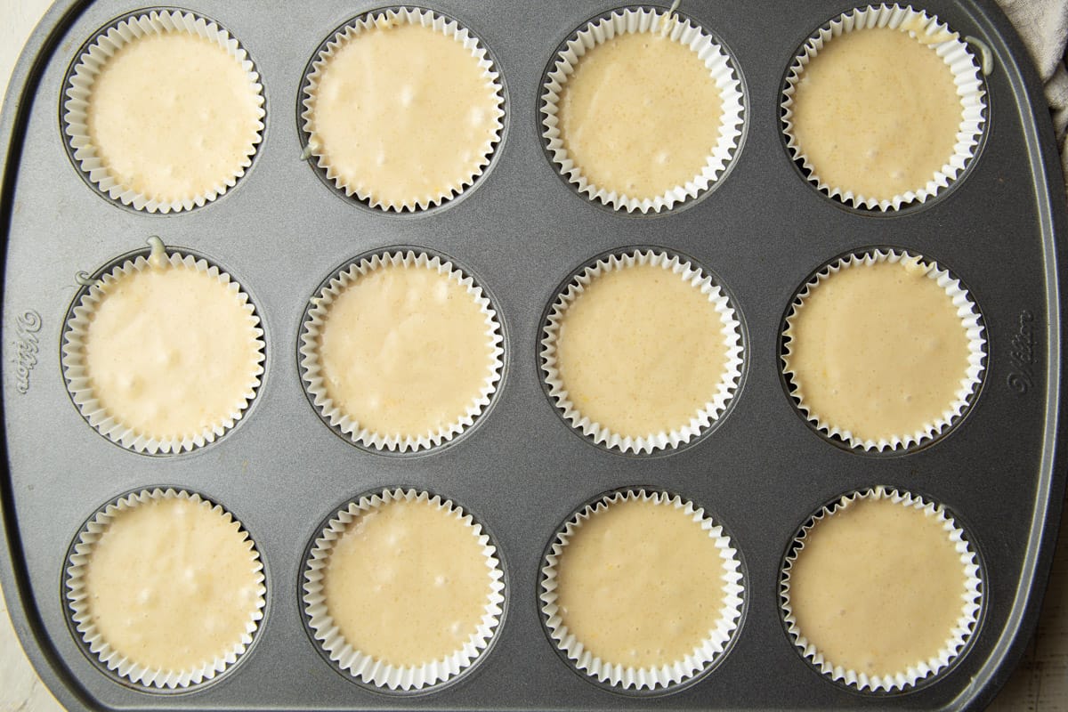 Vegan Lemon Cupcakes batter in a cupcake tin.