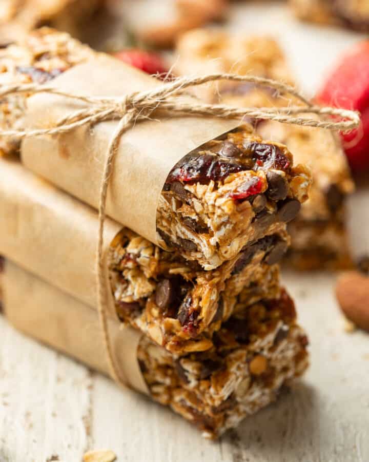 Stack of three Vegan Granola Bars wrapped in paper and twine.