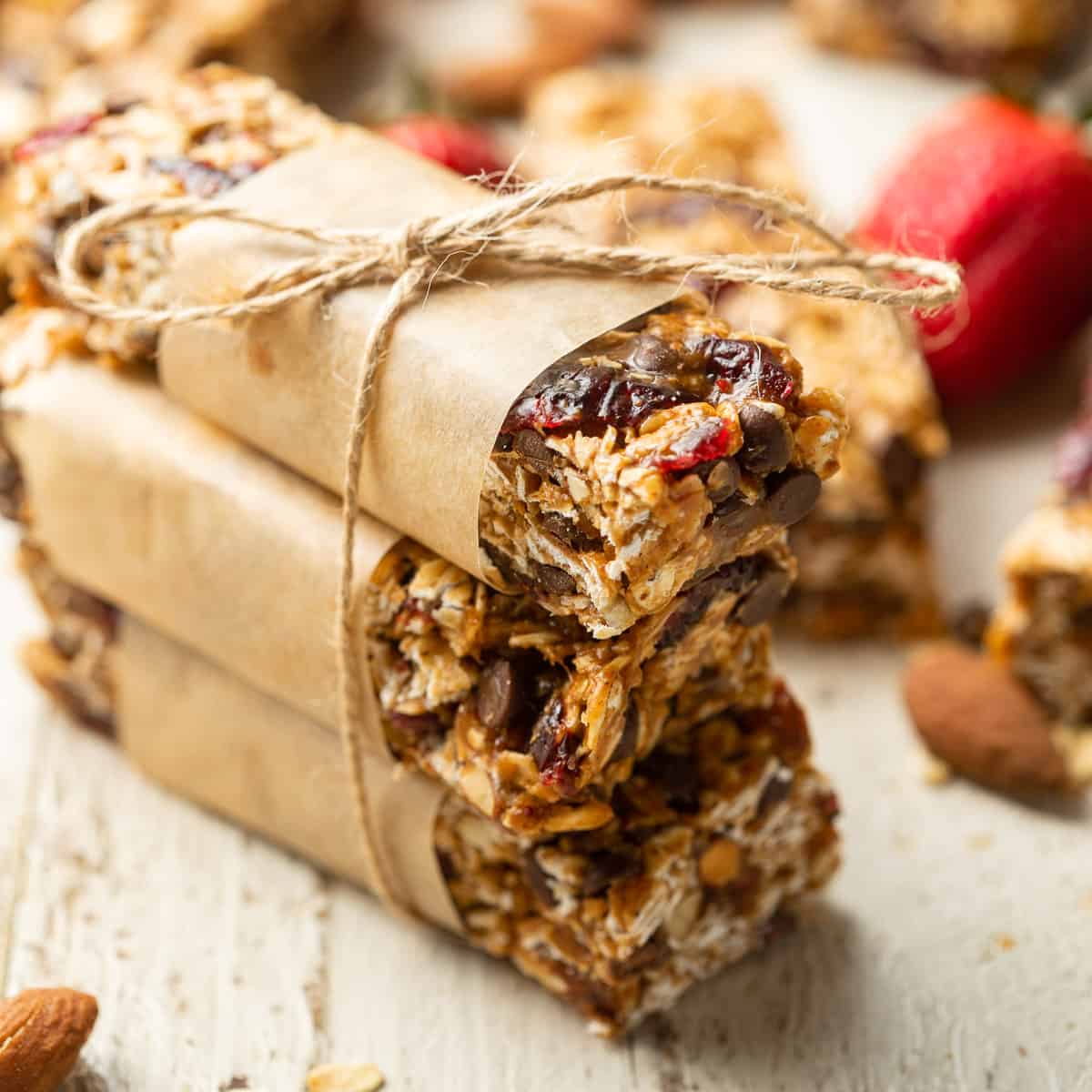 Stack of three Vegan Granola Bars wrapped in paper and twine.
