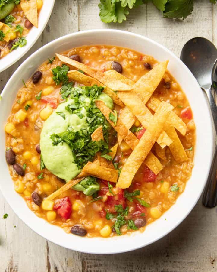 Bowl of Vegan Taco Soup with two spoons on the side.
