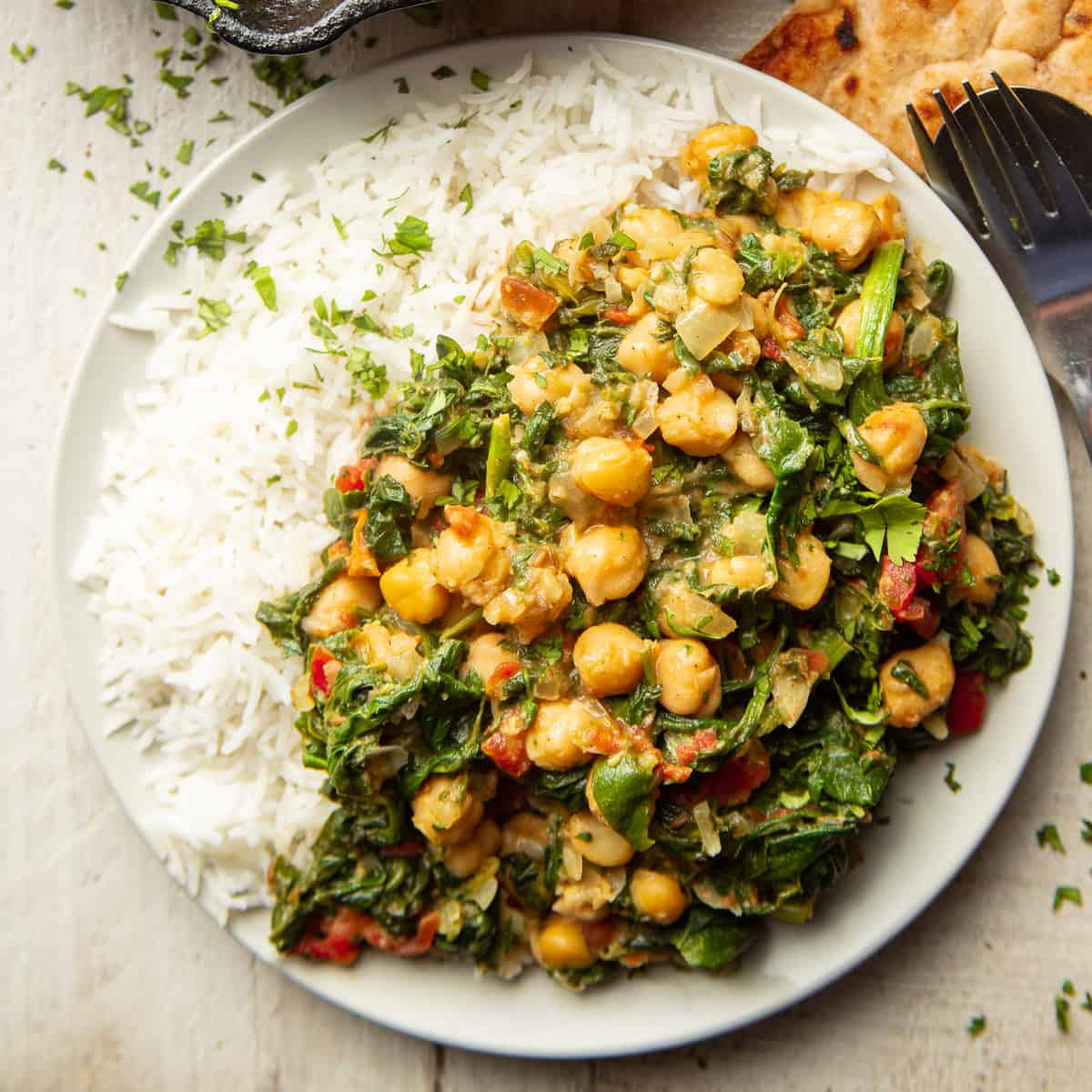 Plate of Chickpea & Spinach Curry over rice.