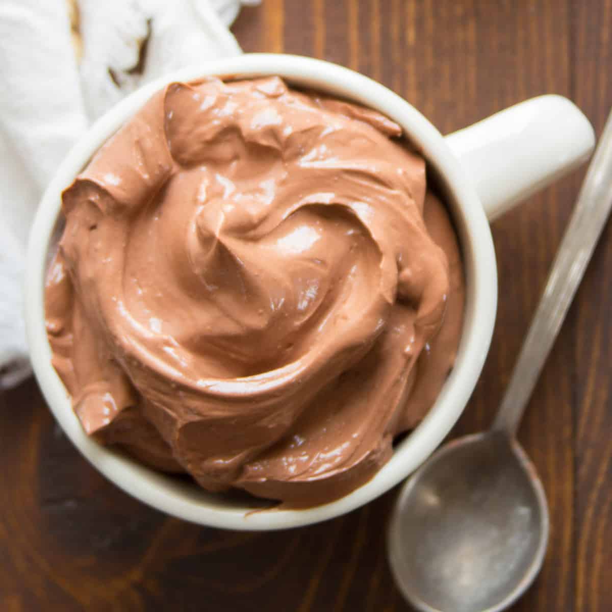 Cup of Vegan Chocolate Pudding with spoon on the side.