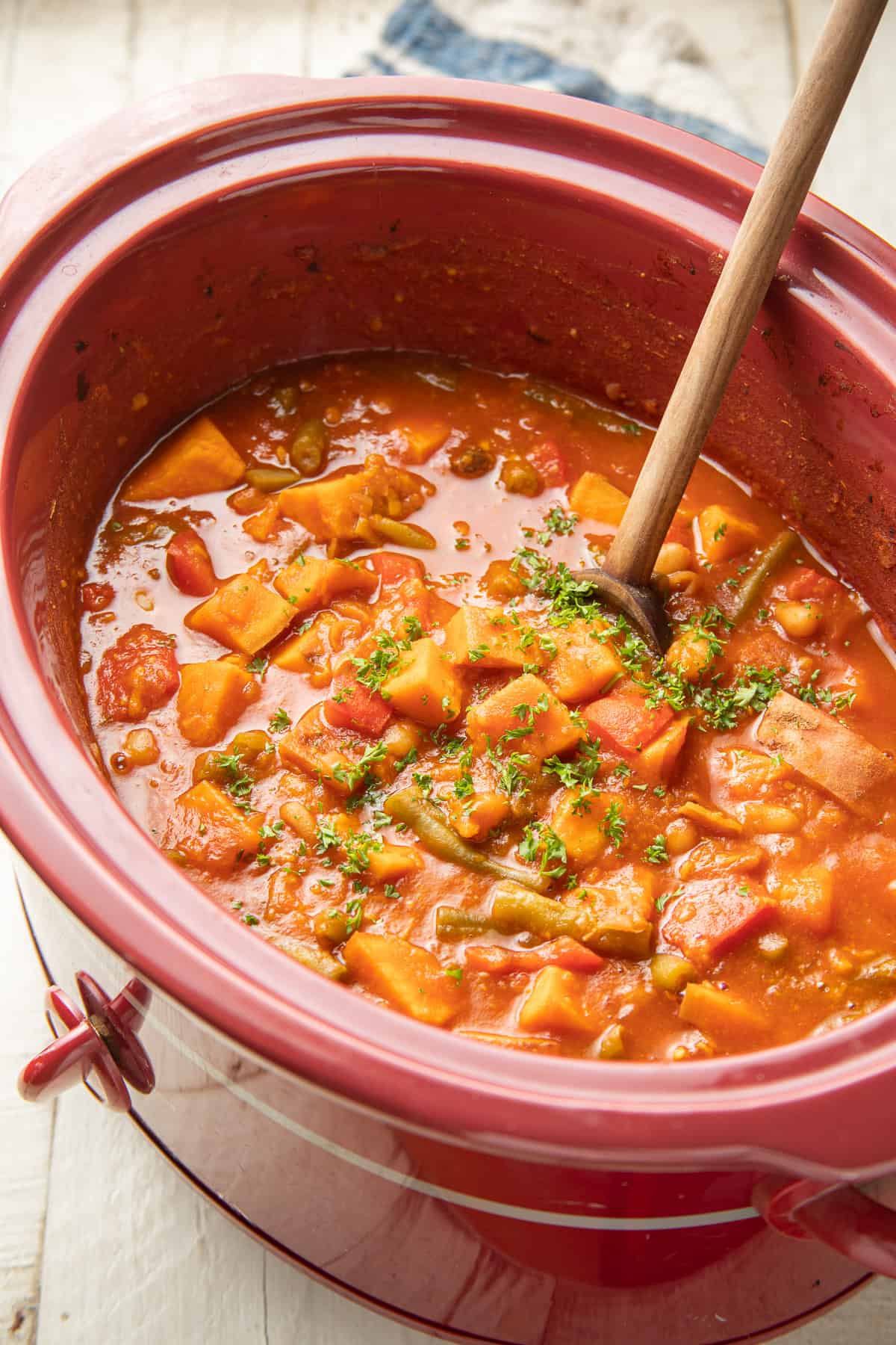 Crock pot filled with vegan stew.
