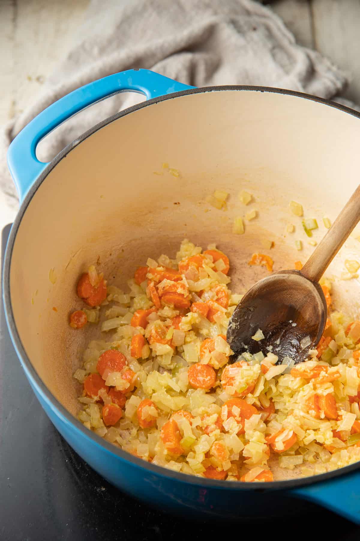 Carrots, onions and flour cooking in a pot.
