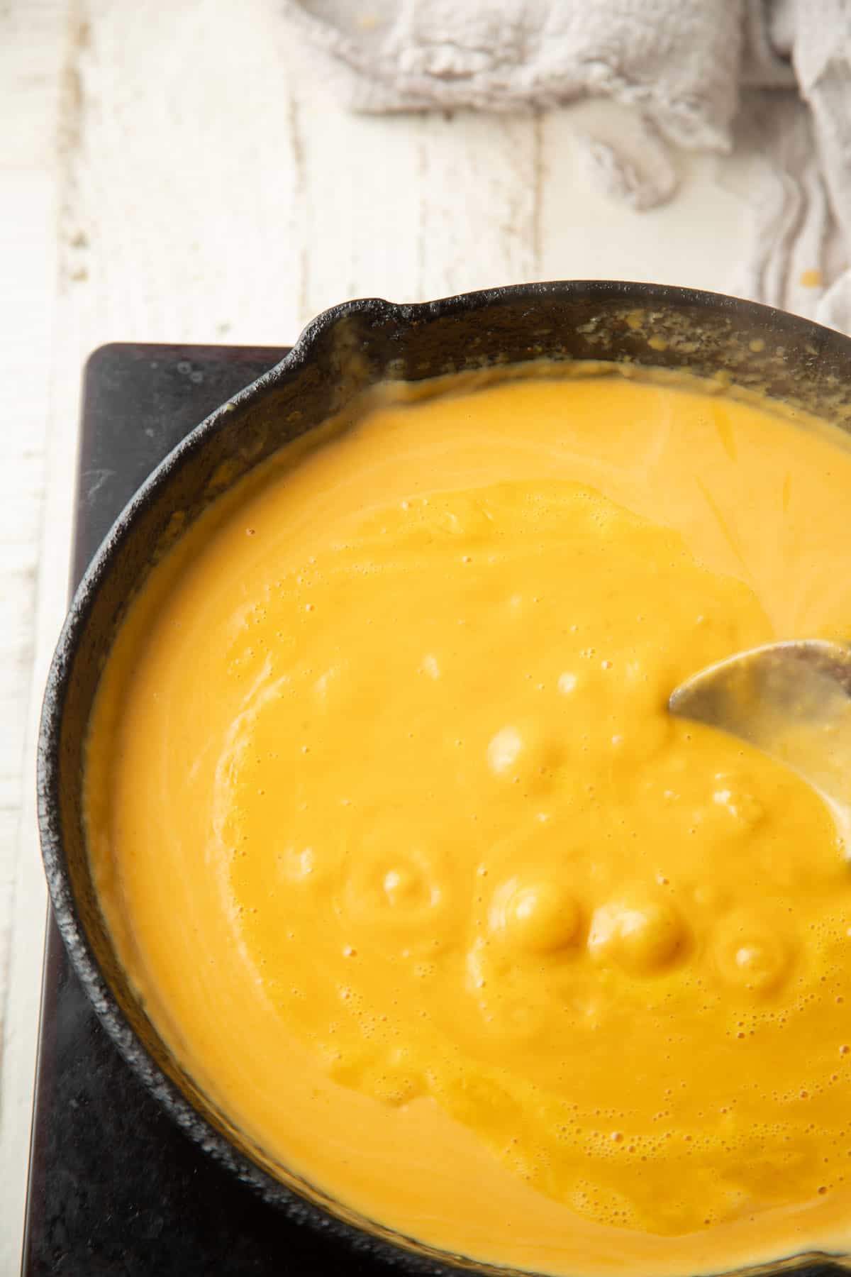Pumpkin sauce simmering in a skillet.