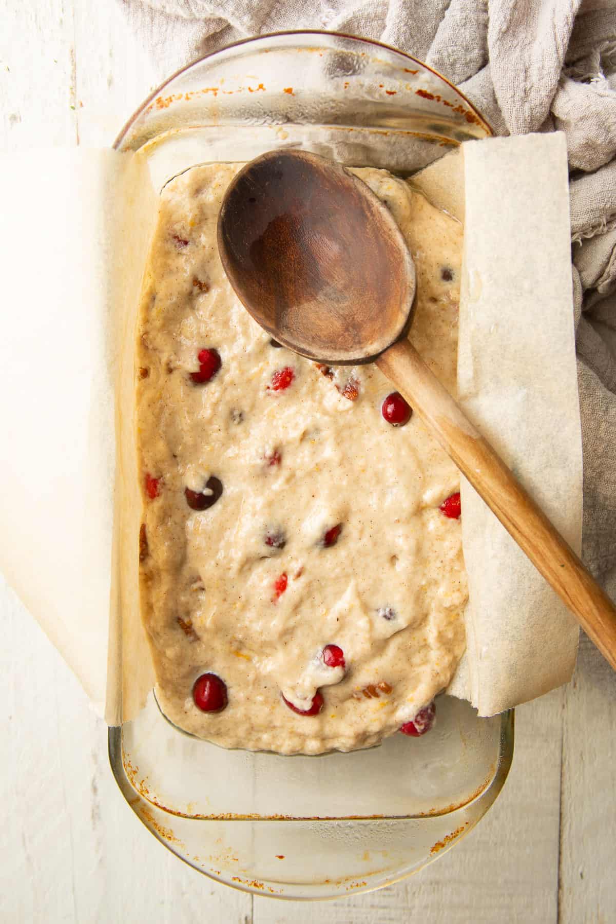 Cranberry bread batter in a loaf pan.