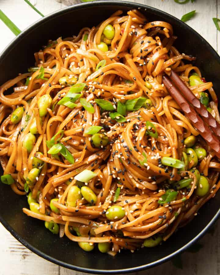 Bowl of Chili Garlic Noodles with chopsticks.