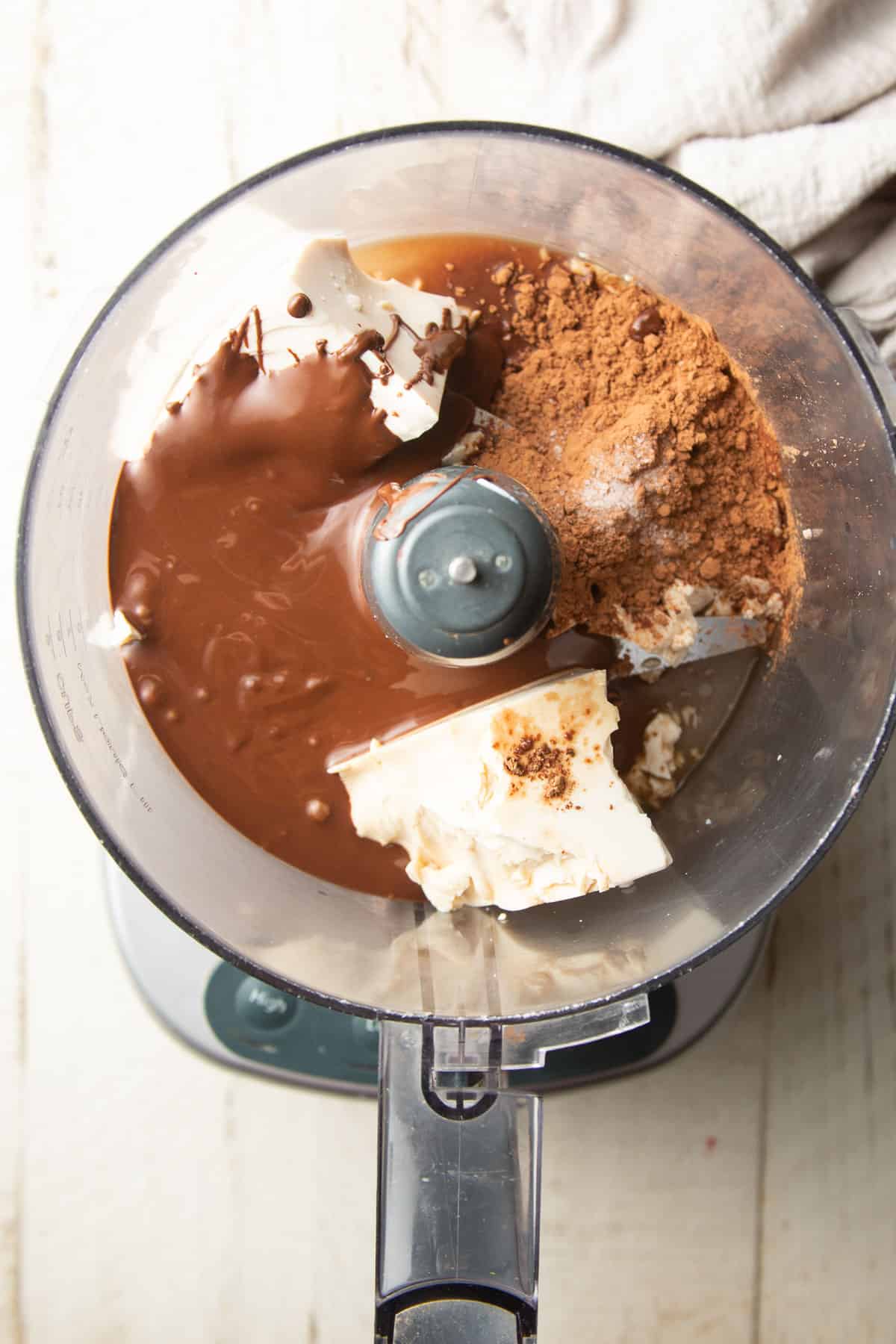 Ingredients for making Vegan Chocolate Pie filling in a food processor bowl.