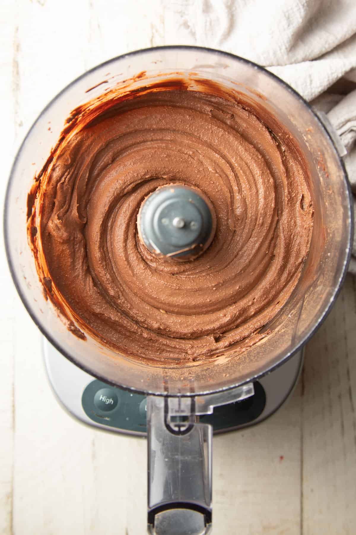 Chocolate pie filling in a food processor bowl.