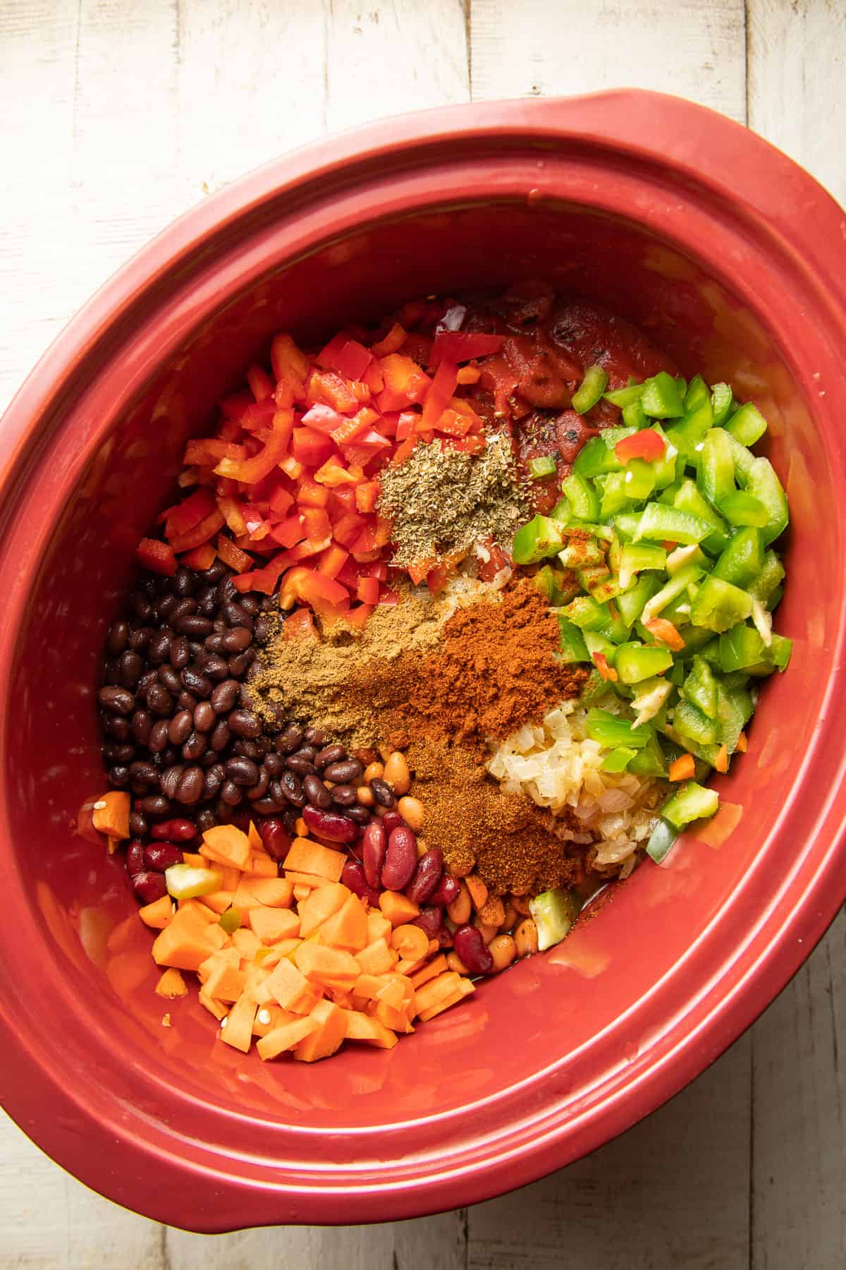 Ingredients for making vegan chili in a slow cooker.
