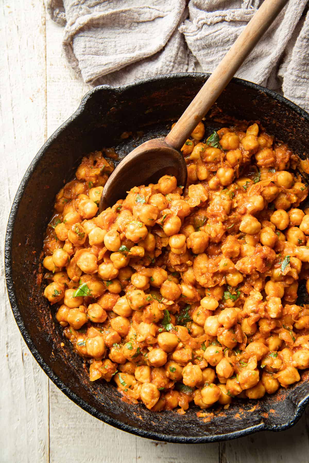 Chickpea Taco filling in a skillet with wooden spoon.