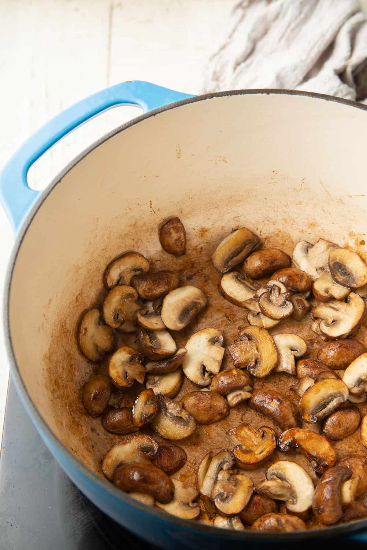 Mushrooms cooking in a pot.